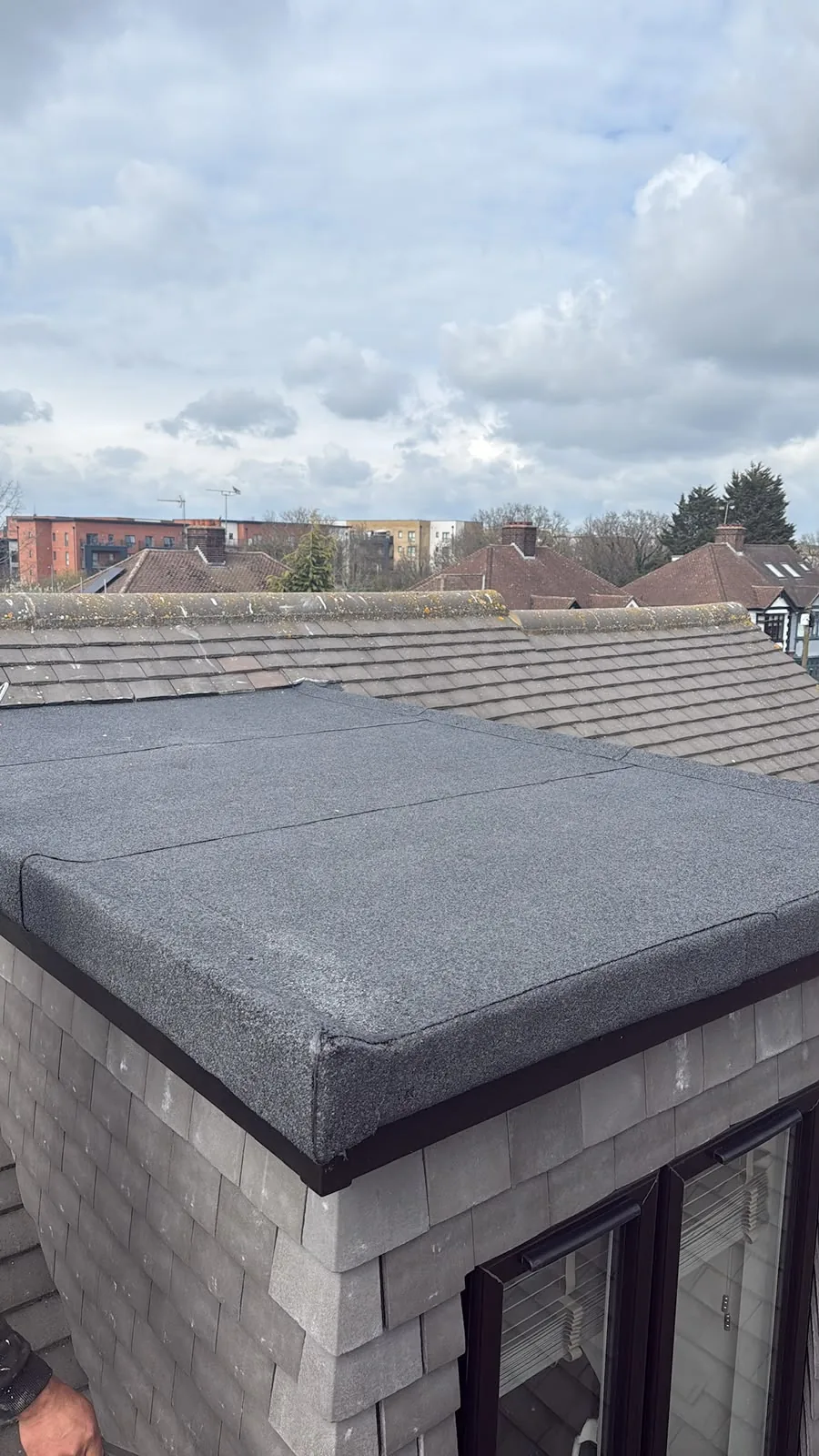 Completed flat roof installation with roof windows